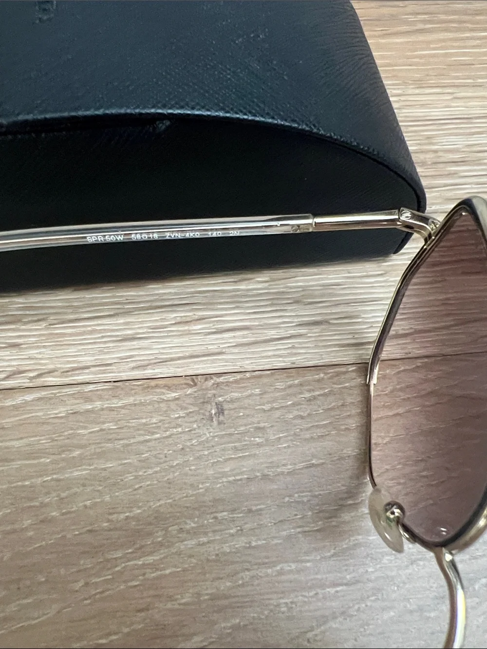 Prada Cat Eye Gold Frame Sunglasses with Brown Gradient Lenses